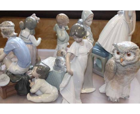 COLLECTION OF LLADRO AND NAO FIGURES
comprising two Lladro figures and eight Nao figures, including a Nao figure of a barn ow