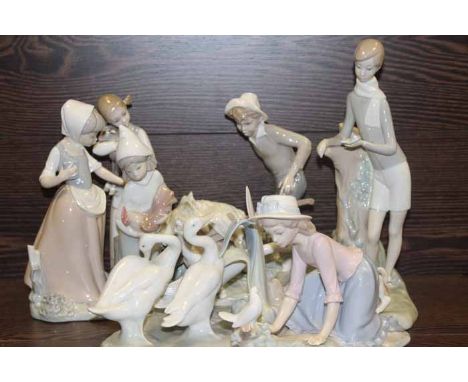 SEVEN LLADRO FIGURES including six child figures with animals or farm animals and a figure of three ducks, largest 27cm high