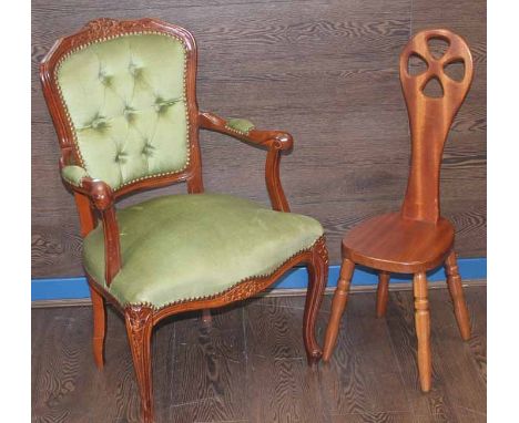 GREEN UPHOLSTERED ARMCHAIR 
together with a reproduction milking stool