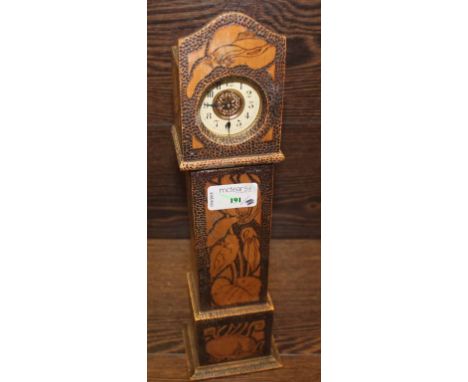 ENAMEL FACED POCKET WATCH
in a pokerwork case formed as a grandfather clock