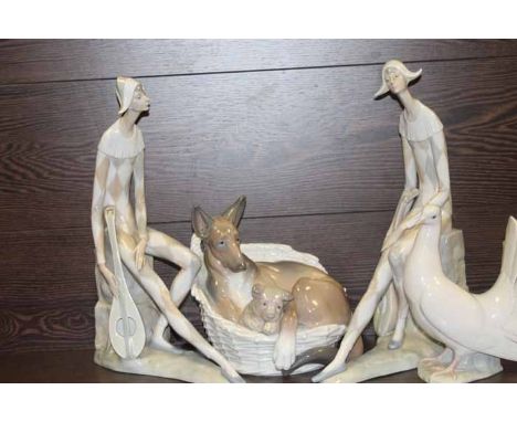 FOUR LLADRO FIGURES including two of a minstrel, an alsatian with a pup in a basket and a dove, largest 36cm high