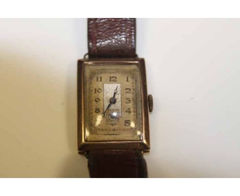 GENTLEMAN'S ART DECO NINE CARAT GOLD WRISTWATCH the gilt dial with Arabic numerals, fitted on vintage leather strap in fitted