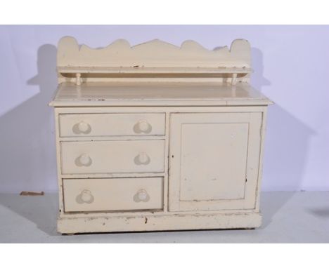 Painted pine Lincolnshire dresser, with a shelf over, fitted with three drawers and a panelled door, width 122cm.