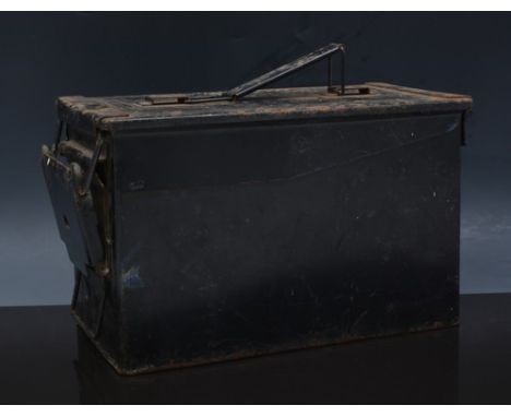 Black metal ammunition box, and a wooden crate.