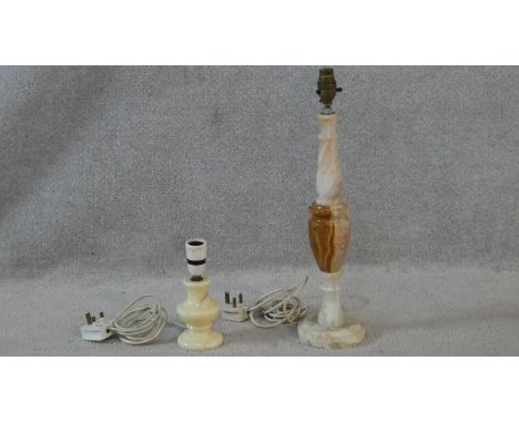 A vintage onyx lamp base along with a similar example. H.48cm (Tallest) 