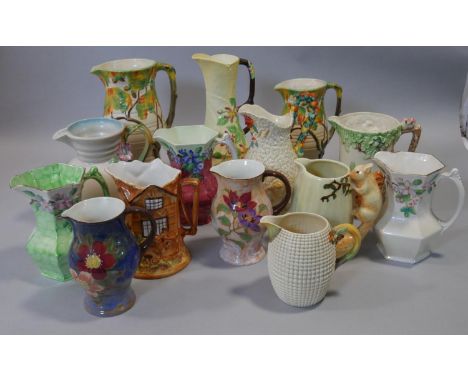 A collection of hand painted Carlton Ware, Royal Doulton, Wade and other vintage ceramic jugs. Makers marks to the bases. H.3