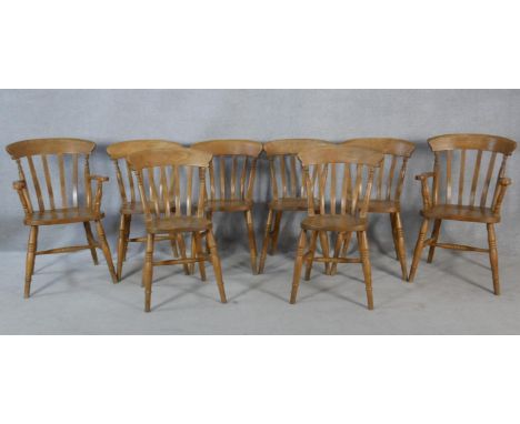 A set of eight 19th century fruitwood stick back dining chairs with moulded seats on turned stretchered supports, includes tw