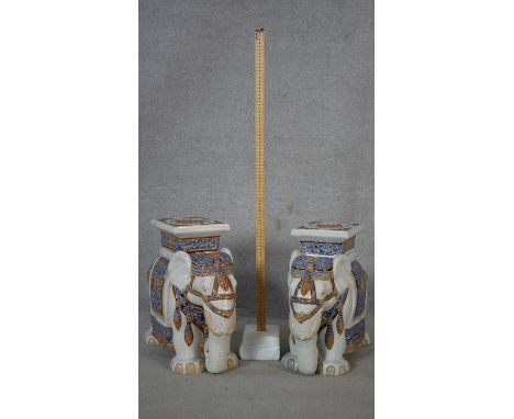 A pair of ceramic polychrome glazed elephant garden seats. H.43cm 