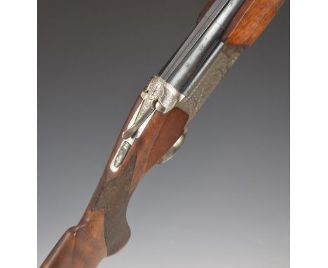 Nikko Model 5000 II 12 bore over and under ejector shotgun with engraved locks, trigger guard, underside, fences and thumb le