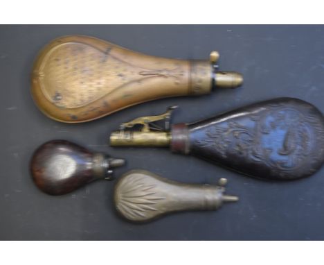 Four various powder and shot flasks comprising two copper examples with embossed decoration, a leather example with embossed 