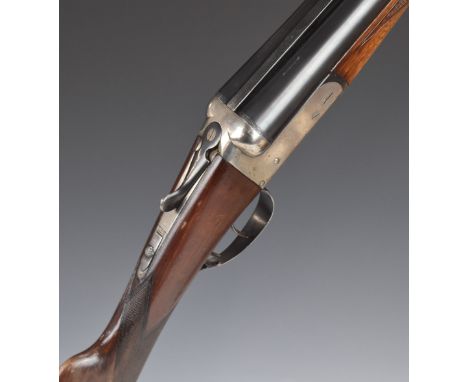 Master 12 bore side by side shotgun with chequered grip and forend, double trigger and named 27.75 inch barrels choked ¼ and 