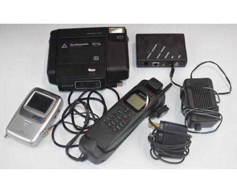 Retor Nokia RAE-1N A mobile phone, Casio TV-970 travel televison and a Kodamatic 970L Polaroid type camera