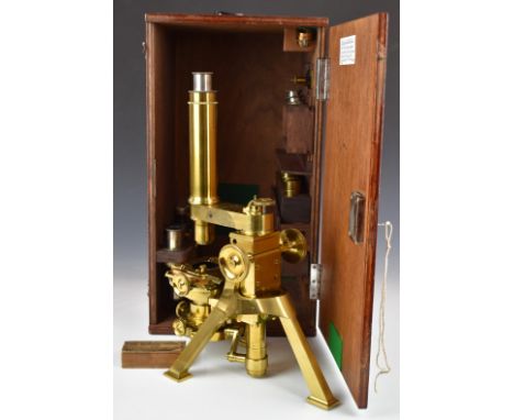 Powell &amp; Lealand Victorian brass microscope, with screw x and y adjustment as well as a rotary dial for the stage, dated 