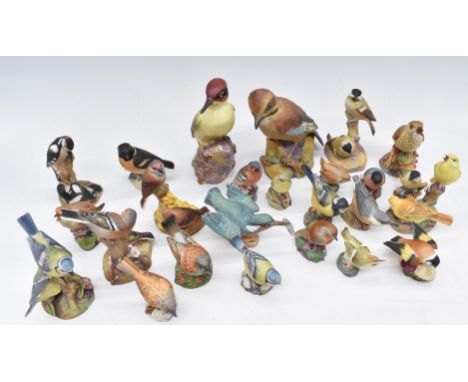 A large collection of Royal Worcester bird figures including woodpecker, jay, blue tits, chaffinches etc, tallest 18cm