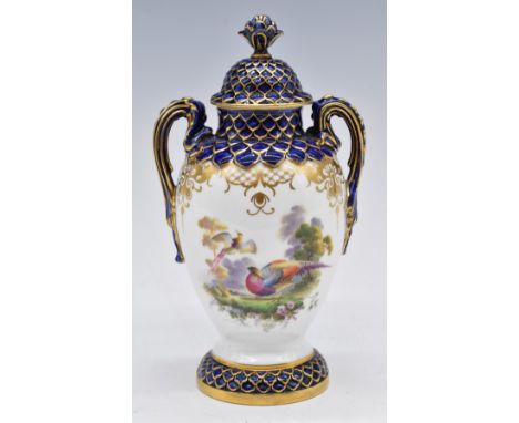 Royal Worcester twin handled covered pedestal vase decorated with Birds of Paradise, signed E Salter to base, H21cm