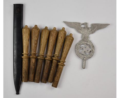 Six wooden socket bayonet handles of various sizes together with a post WW1 M98/05 German bayonet scabbard and a reproduction