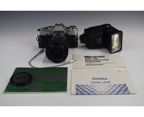 Olympus OM30 35mm SLR camera with Sigma 28-0mm 1:3.5-4.5 lens and Miranda flashgun