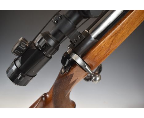 BSA .243 bolt-action rifle with chequered semi-pistol grip and forend, raised cheek-piece, Bushnell 6-24x50 scope and 23 inch