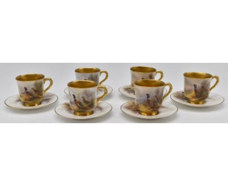 James Stinton for Royal Worcester set of six demitasse cups and saucers decorated with pheasants and gilt interiors, signed S