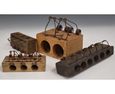 Four vintage choke rat and mouse traps including four and six hole versions