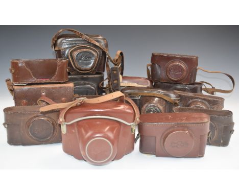 Vintage leather camera cases to include Leica, FED and Ensign