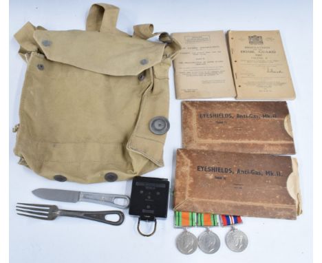 Collection of militaria including marching compass by TG &amp; Co, two Defence medals, War Medal, two Home Guard instruction 