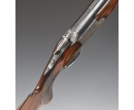 Baikal NK-12 12 bore over and under shotgun with engraved top lever, trigger guard and underside, double trigger, chequered s