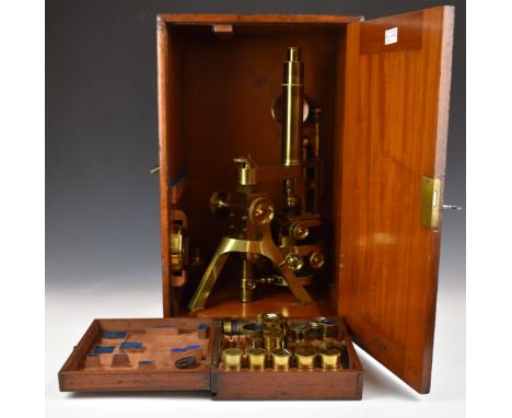 Powell &amp; Lealand Victorian brass microscope, with screw x and y adjustment as well as a rotary dial for the stage, dated 
