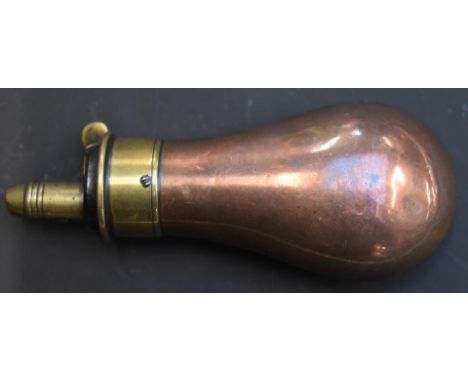 Copper and brass pistol powder flask, 8.8cm long.&nbsp;