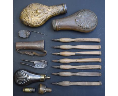 A collection of gun tools and accessories including powder flasks, hand drills and a cutter with niello decoration.&nbsp;