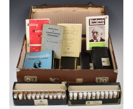 Large collection of vintage homeopathic remedies by Nelson and Co, with related books, all in a vintage suitcase