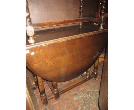 Mid 20th Century oak gate leg table on turned supports, together with a similar dresser and four chairs