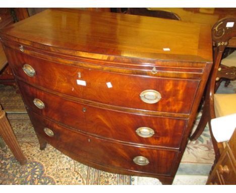 George III mahogany chest of three long drawers with brushing slide having crossbanded top, raised on splayed bracket feet wi