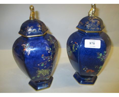 Pair of Carltonware (W & R mark) hexagonal baluster form vases with covers, decorated with exotic birds and foliage in gilt a