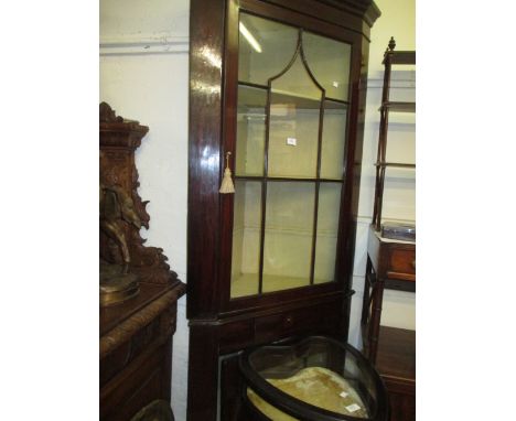 George III mahogany standing corner cabinet having an astragal glazed top section above a short single drawer and panelled do