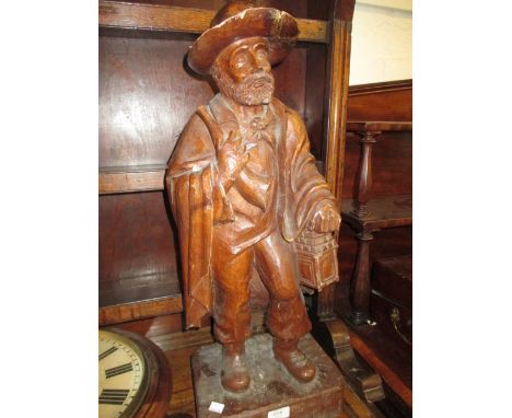19th / 20th Century Dutch carved figure of a man carrying a horn and lantern, 24ins high approximately