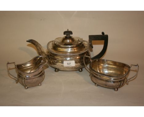 20th Century oval London silver three piece tea service