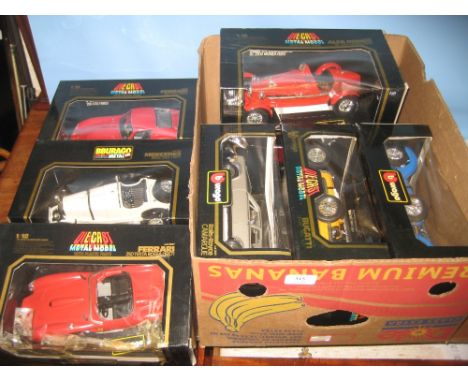 Collection of various large scale die-cast model cars in original boxes