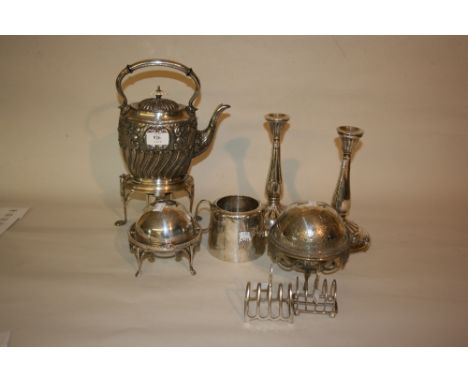 Pair of plated candlesticks, two butter dishes, spirit kettle, a sugar basin, silver toast rack and a plated toast rack