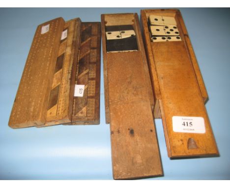Two boxed sets of dominoes and three cribbage boards