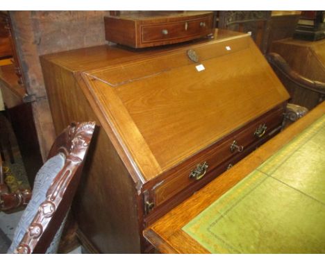 George III mahogany boxwood line inlaid bureau, the fall front enclosing a fitted interior above an arrangement of four gradu