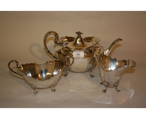 20th Century Sheffield silver three piece tea service of oval faceted design