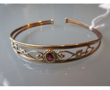 Gold garnet set bangle in fitted box
