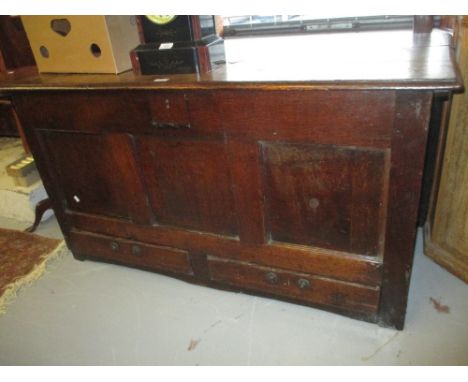 18th Century oak mule chest, the plank top above three panel front and two drawers below