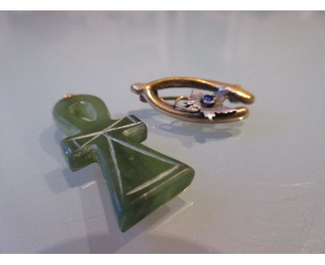 Wishbone brooch together with a small jade pendant