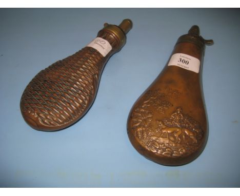 19th Century copper shot flask with embossed decoration together with another similar