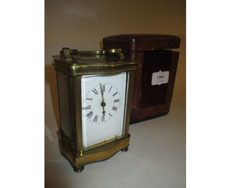 Early 20th Century brass cased carriage clock with enamel dial in original leather covered travelling case (dial a/f)