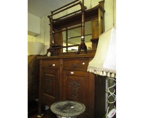 Small Arts and Crafts oak dresser with mirror back, above two drawers and two carved panel doors
