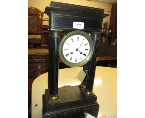 French ebonised portico mantel clock with a white dial within a gilt brass surround, the two train movement striking on a bel