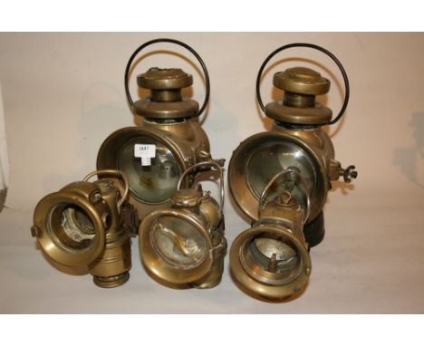 Pair of large Lucas King of the Road motor car lamps, together with two smaller Lucas lamps and a Powell lamp